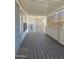 View of a covered porch with decorative screen and wood-look decking at 2233 E Behrend Dr # 17, Phoenix, AZ 85024