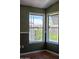 Corner of room with hardwood floors and view of outside at 2233 E Behrend Dr # 17, Phoenix, AZ 85024