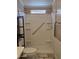Shower featuring a built-in seat and grab bar at 2233 E Behrend Dr # 17, Phoenix, AZ 85024