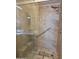 Modern shower with glass door, tile surround, and hand-held shower head at 2233 E Behrend Dr # 17, Phoenix, AZ 85024