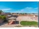 Expansive backyard with desert landscaping, a covered patio, and stunning mountain views at 22966 W Hopi St, Buckeye, AZ 85326