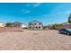 Spacious backyard featuring a covered patio, desert landscaping, and privacy fence at 22966 W Hopi St, Buckeye, AZ 85326