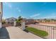 Backyard view with a balcony, a small patch of grass, and surrounding homes at 22966 W Hopi St, Buckeye, AZ 85326