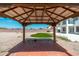 Gazebo overlooking a backyard with gravel, a small patch of grass, and a view of the home at 22966 W Hopi St, Buckeye, AZ 85326