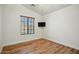 Clean bedroom includes window, ceiling fan, and wood-look floors at 2402 E 5Th St # 1649, Tempe, AZ 85288
