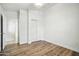 Clean bedroom with wood floors, closet, and bright white walls at 2402 E 5Th St # 1649, Tempe, AZ 85288