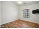 Bright bedroom features wood-look floors, ceiling fan, and a window for natural light at 2402 E 5Th St # 1649, Tempe, AZ 85288