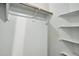 A bright closet with built-in shelving and hanging rod, maximizing storage space at 2402 E 5Th St # 1649, Tempe, AZ 85288