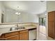 Open kitchen offering stainless appliances, wood cabinets, and an adjacent dining area at 2402 E 5Th St # 1649, Tempe, AZ 85288