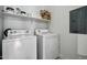Laundry room features a washer, dryer and storage shelf for convenience at 2402 E 5Th St # 1649, Tempe, AZ 85288