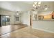 Open-concept living room featuring tile and wood flooring, with bright lighting at 2402 E 5Th St # 1649, Tempe, AZ 85288