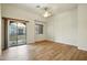 Bedroom with neutral tones, wood flooring, balcony, and window at 2402 E 5Th St # 1649, Tempe, AZ 85288