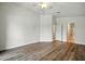 Open bedroom with ensuite bathroom, wood floors, and natural light at 2402 E 5Th St # 1649, Tempe, AZ 85288