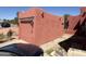 Single car garage with a rustic wood facade and a door matching the home's stucco color at 25449 W Pueblo Ave, Buckeye, AZ 85326