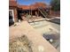 Outdoor pool with deck and stairs leading to the red home, creating a relaxing retreat at 25449 W Pueblo Ave, Buckeye, AZ 85326