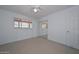 Bedroom exhibiting tile floors, a ceiling fan, mirrored closet doors, and a window at 2922 W Citrus Way, Phoenix, AZ 85017