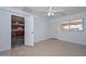 Spacious bedroom shows tile flooring and adjacent kitchen with stainless appliances at 2922 W Citrus Way, Phoenix, AZ 85017
