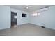 Bright bedroom offers tile flooring and window with natural light at 2922 W Citrus Way, Phoenix, AZ 85017