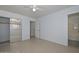 This bedroom features neutral paint, a ceiling fan, and mirrored closet doors at 2922 W Citrus Way, Phoenix, AZ 85017