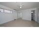 This bedroom features neutral paint, a ceiling fan, and mirrored closet doors at 2922 W Citrus Way, Phoenix, AZ 85017