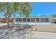 Quaint single-story home featuring a screened porch, a covered carport, and xeriscaped front yard at 2922 W Citrus Way, Phoenix, AZ 85017
