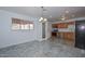 Modern kitchen with stainless appliances, tile flooring, and access to the outside at 2922 W Citrus Way, Phoenix, AZ 85017
