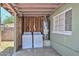 Outdoor laundry area featuring modern washer and dryer, plus a recently installed water heater with easy access at 2922 W Citrus Way, Phoenix, AZ 85017