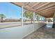 Covered screened porch that has views of the street and palm trees at 2922 W Citrus Way, Phoenix, AZ 85017