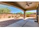 Inviting covered back patio with brick pavers, water fountain, stone columns, and a ceiling fan at 3030 N Saranac --, Mesa, AZ 85207