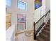 Bright foyer with high ceilings, unique flooring design, and stairwell at 3030 N Saranac --, Mesa, AZ 85207