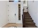 Inviting foyer featuring a staircase and a well-lit entrance with tiled flooring and a solid, white front door at 3030 N Saranac --, Mesa, AZ 85207