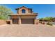 This home features a two-car garage, brick-paved driveway, desert landscaping and a charming gate at 3030 N Saranac --, Mesa, AZ 85207