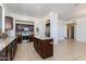 Spacious kitchen with island, stainless steel appliances, granite countertops, and tiled floors, creating a modern look at 3030 N Saranac --, Mesa, AZ 85207