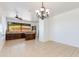 Bright, open kitchen boasts dark wood cabinetry, an island, and tiled floors, blending style and functionality at 3030 N Saranac --, Mesa, AZ 85207