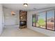 The living room boasts a stone fireplace, large windows, and neutral carpet, perfect for cozy evenings and entertaining at 3030 N Saranac --, Mesa, AZ 85207