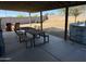Covered patio with an outdoor dining area, seating and a small above ground pool at 30394 N Appalachian Trl, San Tan Valley, AZ 85143