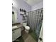 Modern bathroom featuring a vanity, toilet, and decorative black and white shower curtain at 30394 N Appalachian Trl, San Tan Valley, AZ 85143