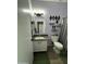 Bathroom featuring a stylish vanity, mirror, and an accent wall decor at 30394 N Appalachian Trl, San Tan Valley, AZ 85143