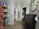 Well-lit bathroom with shelving and a view of the closet, combining style and functionality at 30394 N Appalachian Trl, San Tan Valley, AZ 85143