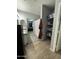 Bathroom featuring dual sink vanity, shower, and a shelf for ample storage at 30394 N Appalachian Trl, San Tan Valley, AZ 85143