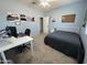 Bedroom boasts neutral walls, a ceiling fan, and a dedicated desk area at 30394 N Appalachian Trl, San Tan Valley, AZ 85143