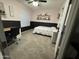 Comfortable bedroom with stylish decor, plush carpet and a black and pink color scheme at 30394 N Appalachian Trl, San Tan Valley, AZ 85143