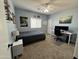 Bedroom filled with natural light, a desk setup, and a ceiling fan at 30394 N Appalachian Trl, San Tan Valley, AZ 85143