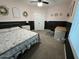 Bedroom with gold metal bed frame, desk, and soft carpeting at 30394 N Appalachian Trl, San Tan Valley, AZ 85143