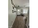 Inviting entryway with a gallery wall, wood-look tile flooring, and plenty of natural light at 30394 N Appalachian Trl, San Tan Valley, AZ 85143