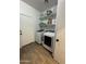 Convenient laundry room with modern washer and dryer, offering ease and efficiency at 30394 N Appalachian Trl, San Tan Valley, AZ 85143