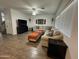 Spacious living room with tile floors, comfortable seating, and plenty of natural light at 30394 N Appalachian Trl, San Tan Valley, AZ 85143