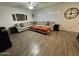 Bright living room boasts tile floors, a large sectional sofa, and abundant natural light at 30394 N Appalachian Trl, San Tan Valley, AZ 85143