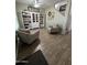 Cozy seating area with wood-look tile flooring and a built-in bookshelf creates a relaxing atmosphere at 30394 N Appalachian Trl, San Tan Valley, AZ 85143