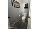 Cozy toilet room adorned with decorative wall art and a gray rug at 30394 N Appalachian Trl, San Tan Valley, AZ 85143
